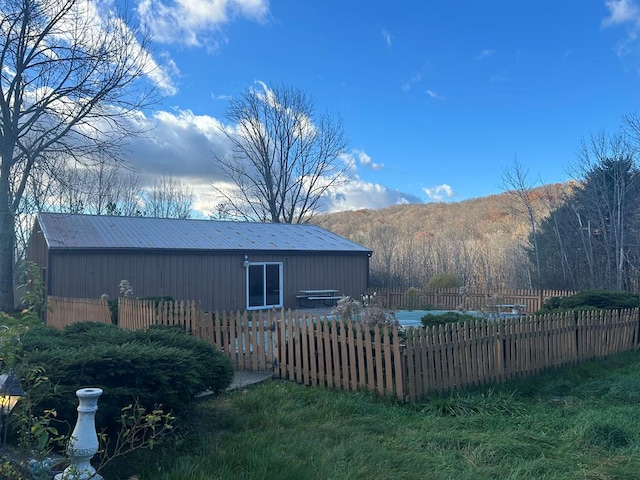 view of property exterior featuring a mountain view