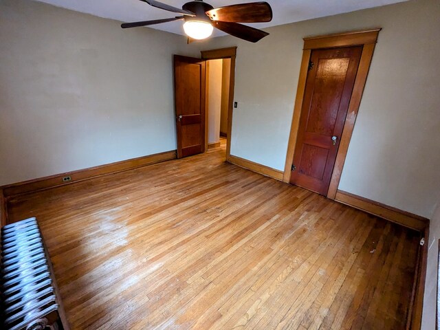 unfurnished bedroom with light hardwood / wood-style floors and ceiling fan