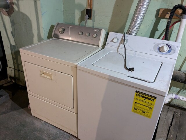 laundry area with independent washer and dryer