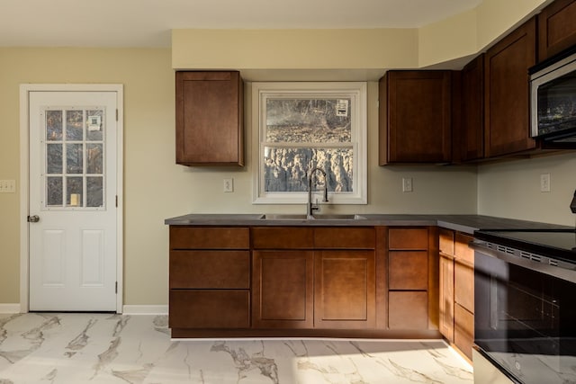 kitchen with electric stove and sink