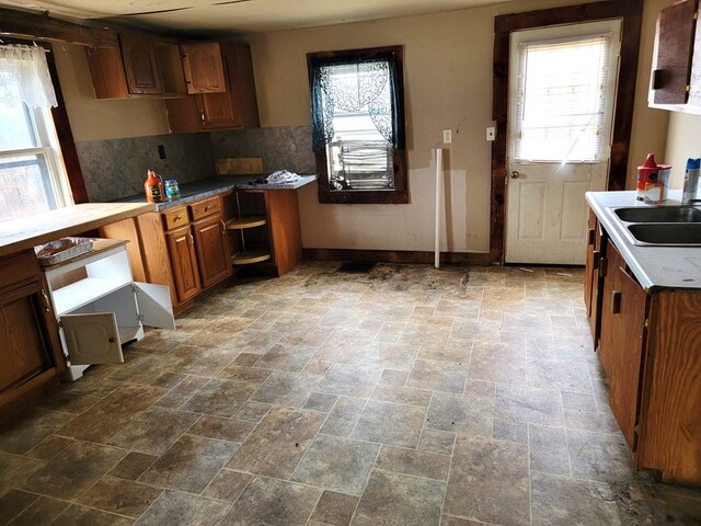 kitchen with tasteful backsplash and sink