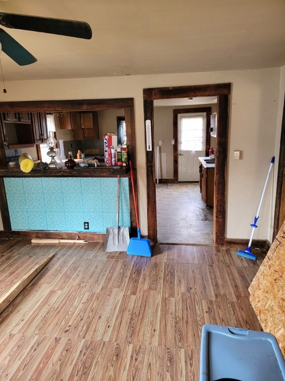 interior space featuring hardwood / wood-style flooring and ceiling fan