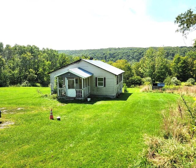 view of outbuilding featuring a lawn