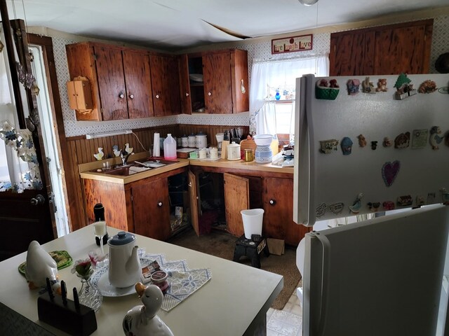 kitchen with sink and refrigerator