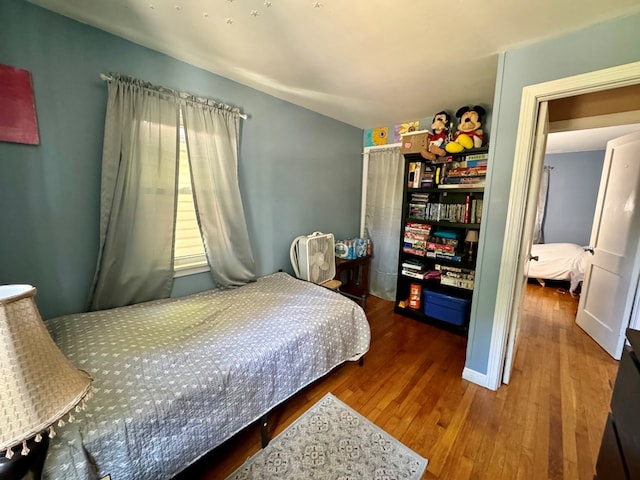 bedroom featuring wood-type flooring