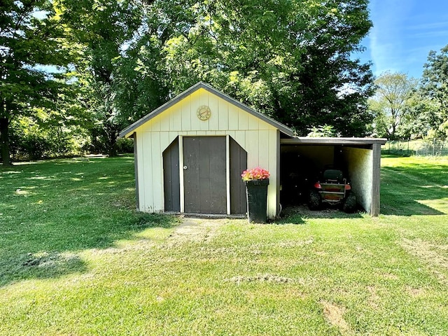 view of outdoor structure featuring a lawn