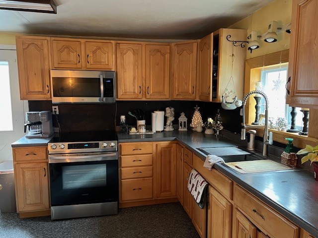 kitchen featuring stainless steel appliances and sink