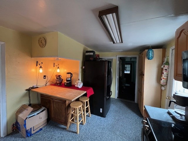 kitchen with black refrigerator