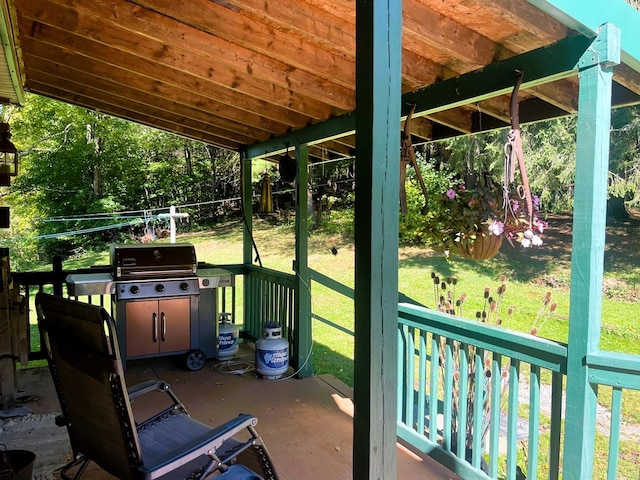 unfurnished sunroom featuring lofted ceiling