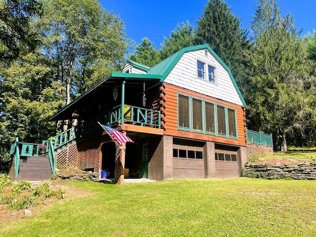 exterior space with a garage and a lawn