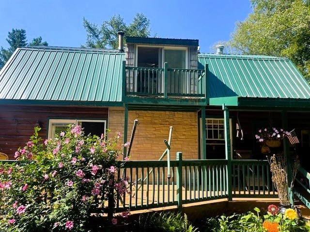 rear view of house with a balcony