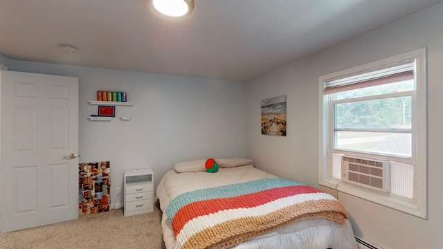 carpeted bedroom with cooling unit and baseboard heating