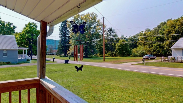 view of yard featuring covered porch