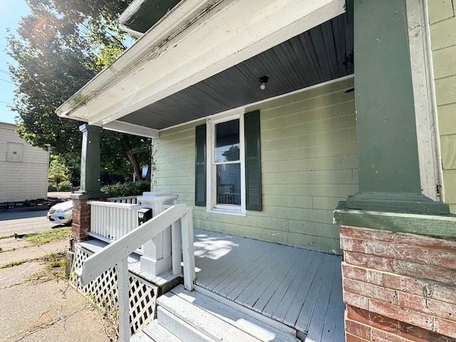 wooden terrace with a porch