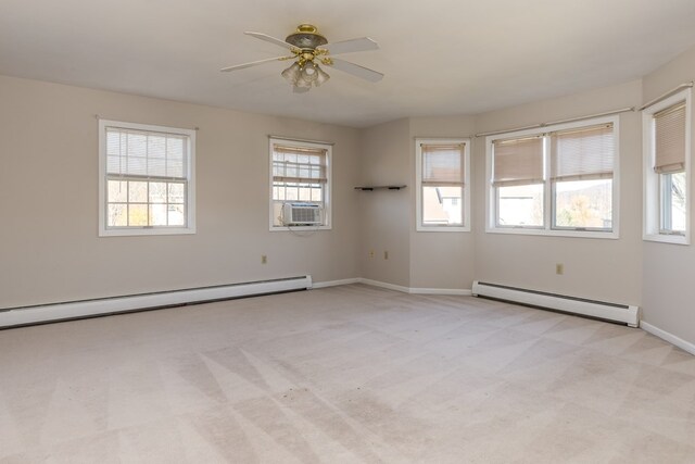 carpeted empty room with a baseboard heating unit, cooling unit, and ceiling fan