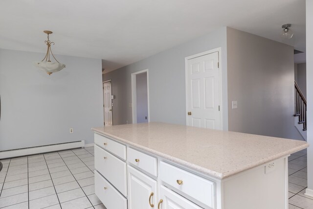 kitchen with a kitchen island, pendant lighting, white cabinetry, light tile patterned floors, and baseboard heating