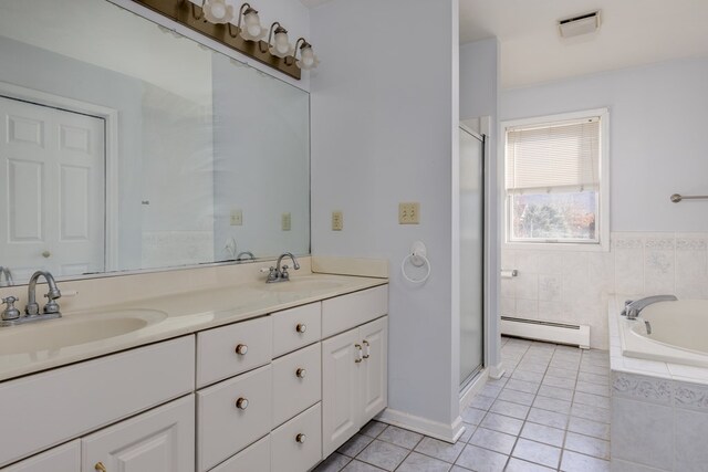 bathroom with vanity, separate shower and tub, tile patterned floors, and baseboard heating