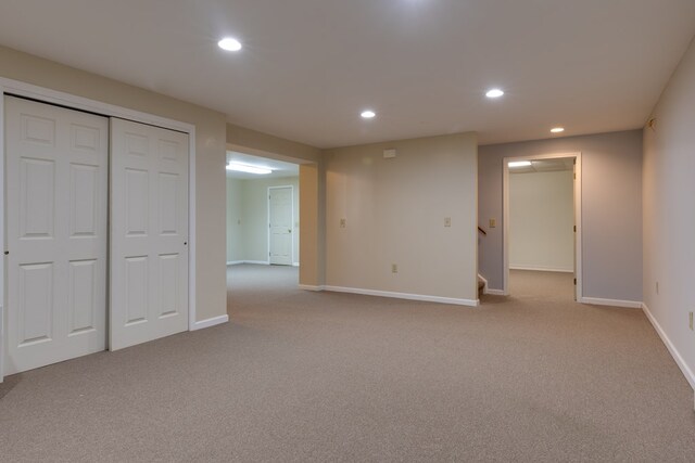 interior space featuring light carpet