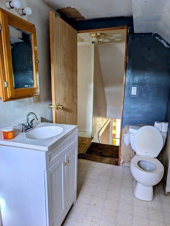 bathroom featuring vanity and toilet