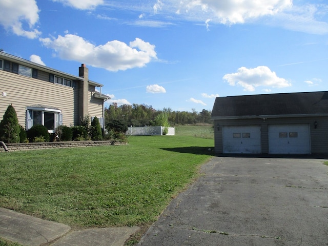 view of yard featuring a garage