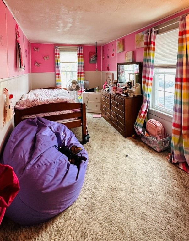 bedroom featuring carpet flooring and a textured ceiling