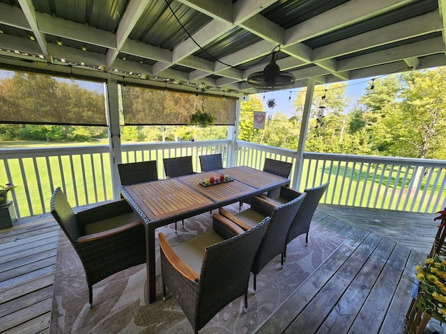 wooden terrace with a yard and ceiling fan