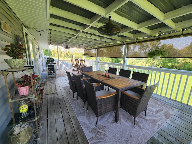 deck featuring area for grilling and ceiling fan