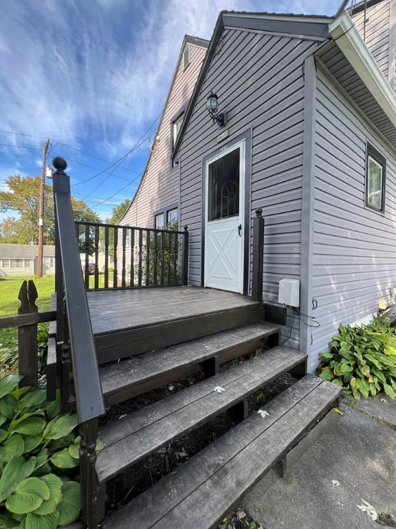 entrance to property with a wooden deck