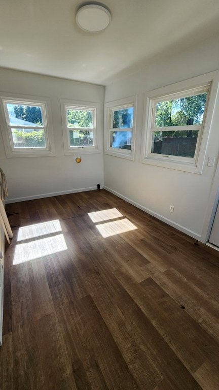 unfurnished room featuring dark hardwood / wood-style floors