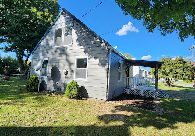 view of side of property with a yard