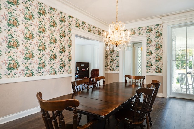 dining room featuring an inviting chandelier, a wealth of natural light, dark wood-type flooring, and ornamental molding