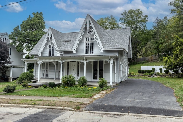 victorian house featuring a porch