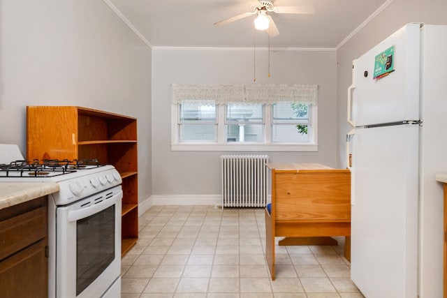 kitchen with crown molding, white appliances, ceiling fan, radiator heating unit, and light tile patterned flooring