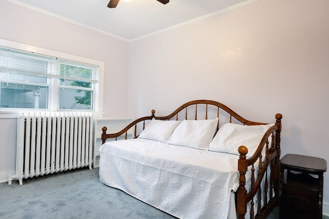 carpeted bedroom featuring ceiling fan, ornamental molding, and radiator