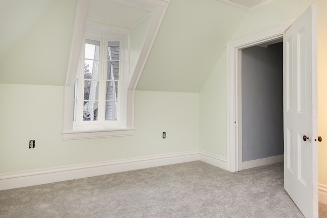 bonus room featuring light carpet and lofted ceiling