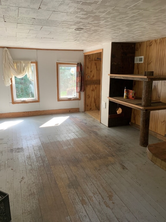 spare room with wood-type flooring