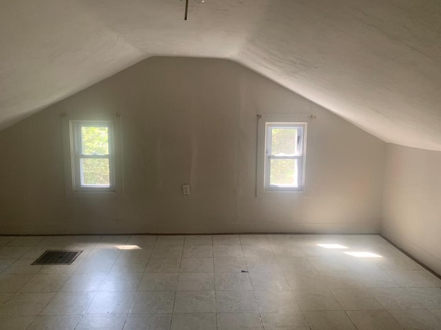 bonus room with vaulted ceiling