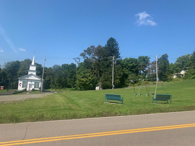 surrounding community with a playground and a lawn