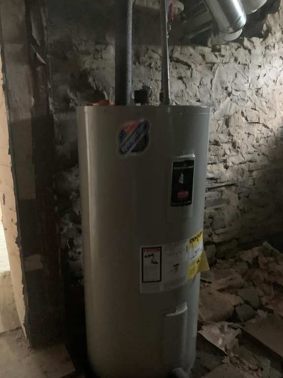 utility room with water heater