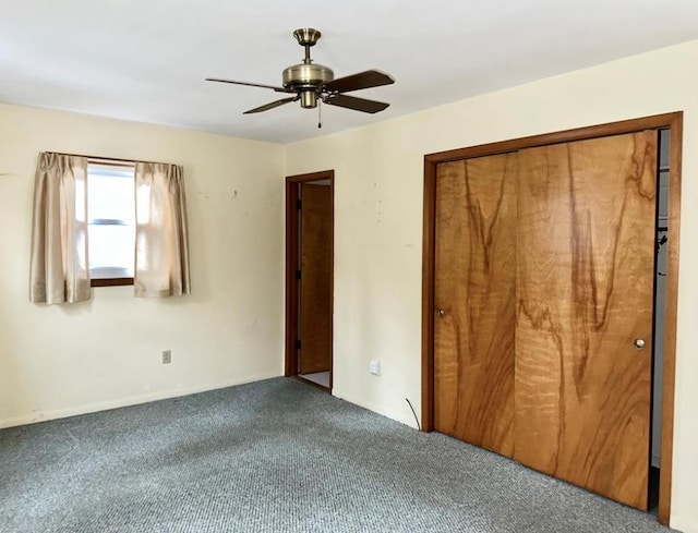 unfurnished bedroom featuring carpet, ceiling fan, and a closet