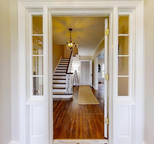 188 Upper Delevan Ave, Corning-City, NY 14830 - entryway featuring stairway, hardwood / wood-style flooring, a chandelier, crown molding, and arched walkways