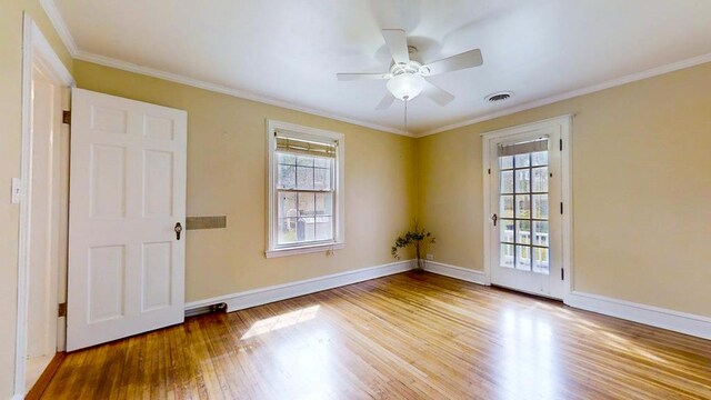 188 Upper Delevan Ave, Corning-City, NY 14830 - unfurnished room featuring plenty of natural light, wood finished floors, baseboards, a ceiling fan, and crown molding