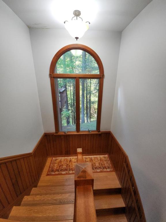 stairway with wood walls