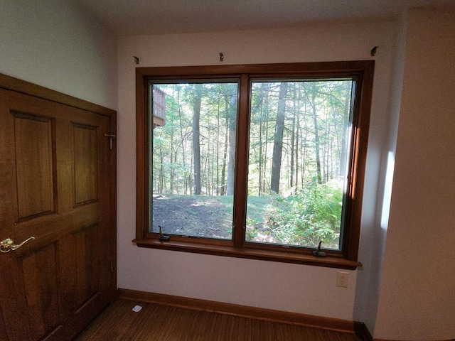 interior space with dark hardwood / wood-style flooring