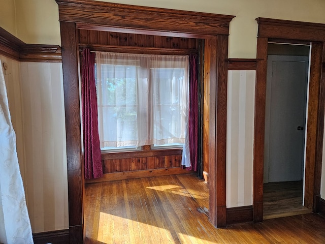 hallway with hardwood / wood-style floors