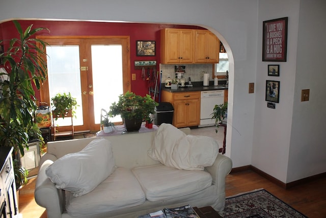 living room with hardwood / wood-style floors and french doors