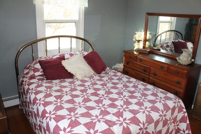 bedroom featuring a baseboard heating unit