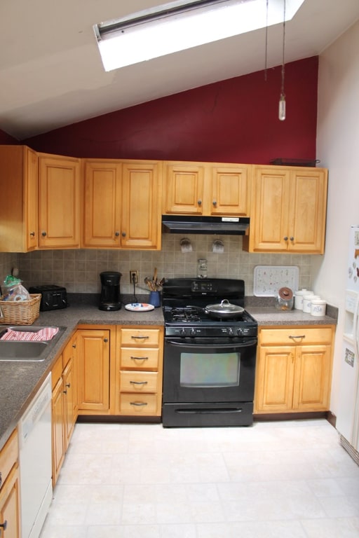 kitchen featuring lofted ceiling, sink, tasteful backsplash, black gas stove, and dishwasher