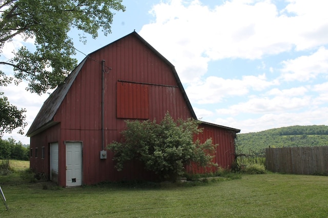 view of outdoor structure featuring a lawn