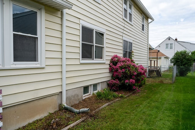 view of home's exterior featuring a lawn